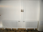 Panelový dům Brožíkova - radiátory s regulačními ventily Danfoss